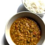 A bowl of Dal Fry (Spicy Lentils) served alongside a bowl of plain Basmati rice.