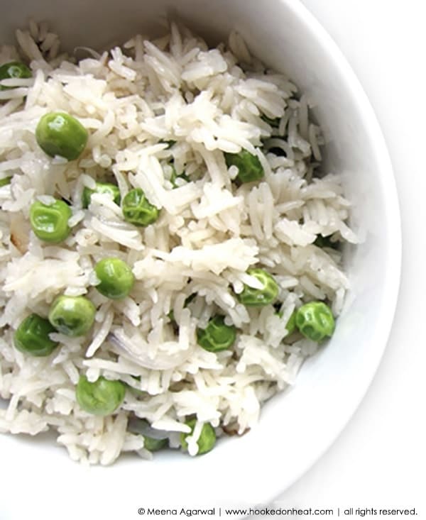 Recipe for Matar Pulao (Peas Pilaf), taken from www.hookedonheat.com. Visit site for detailed recipe.