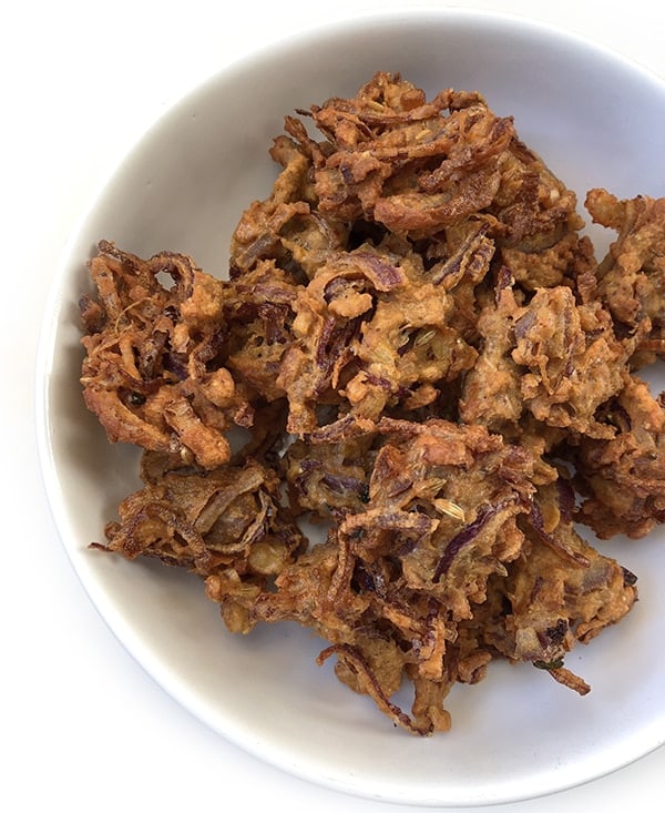 A bowl of crispy Onion Pakoda (Indian-style Onion Fritters)