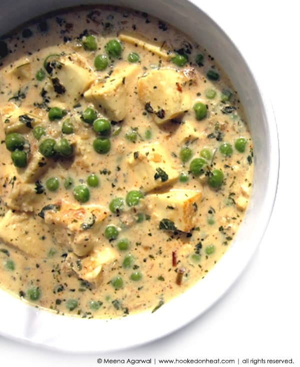 A bowl of Paneer Methi Malai with Peas.