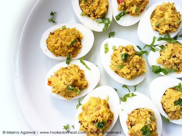Recipe for Spicy Masala Devilled Eggs taken from www.hookedonheat.com. Visit site for detailed recipe.