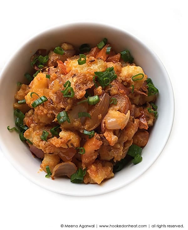 A bowl of Aloo Tamatar Sabzi (Potato and Tomato Stir-fry)