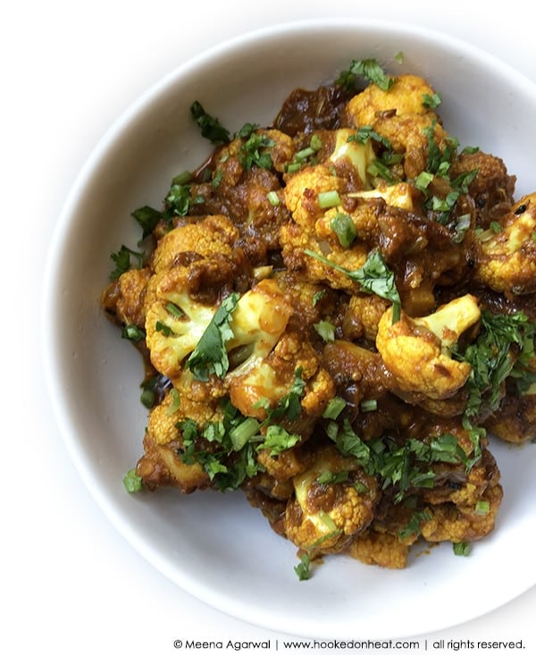 Recipe for Achari Gobhi (Spiced Cauliflower - Indian-style) taken from www.hookedonheat.com. Visit site for detailed recipe.