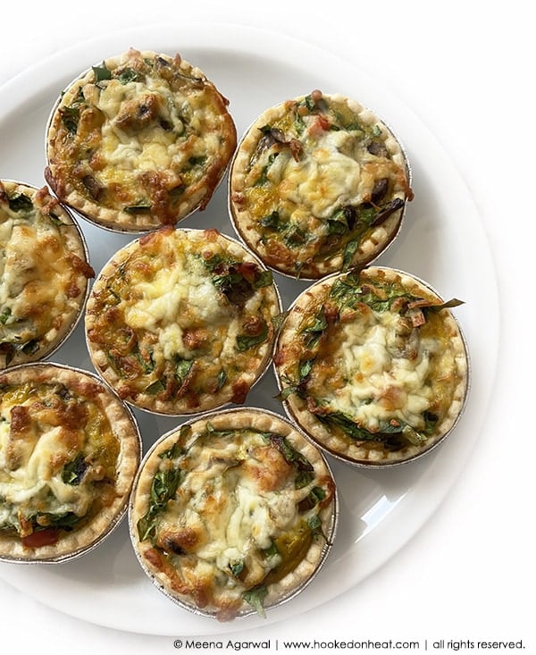 A platter of Spinach Mushroom Feta Quiche