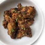 A plate of Tandoori Chicken Wings garnished with fresh cilantro.