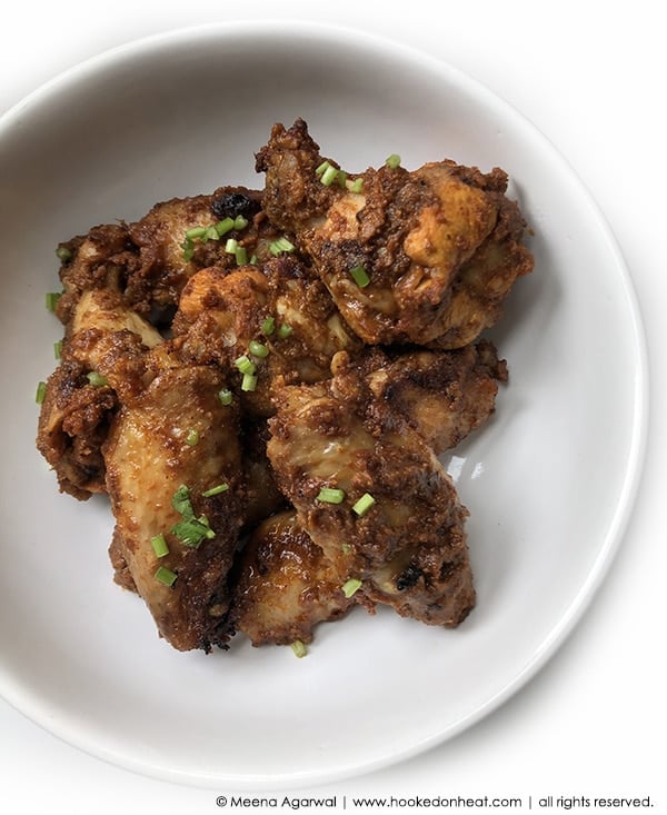 A plate of Tandoori Chicken Wings garnished with fresh cilantro.