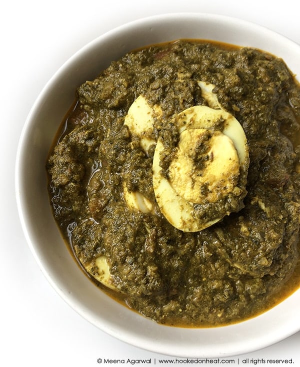 A bowl of Palak Egg Curry (Spinach Egg Curry).