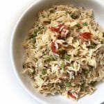 A bowl of Matar Pulao, flavoured rice cooked with Peas, Tomatoes and Spices