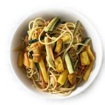 A bowl of Peanut Noodles with Tofu and Mango