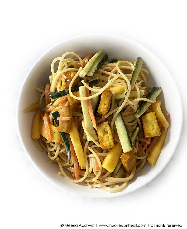A bowl of Peanut Noodles with Tofu and Mango
