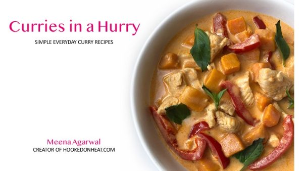 A bowl of creamy curry with chicken, red bell peppers, orange chunks, and fresh basil leaves. Text reads “Curries in a Hurry: Simple Everyday Curry Recipes” by Meena Agarwal, creator of hookedonheat.com.